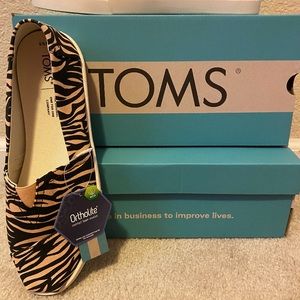 Tom’s Toms tiger stripe slip ons